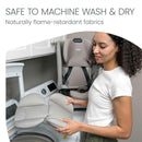 Britax One4life® Slim All-In-One Car Seat in Mineral Gray, featuring removable parts being held by a woman near a washing machine.