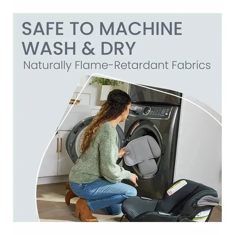 Woman placing a car seat insert into a washing machine, promoting machine washability and flame-retardant fabrics.