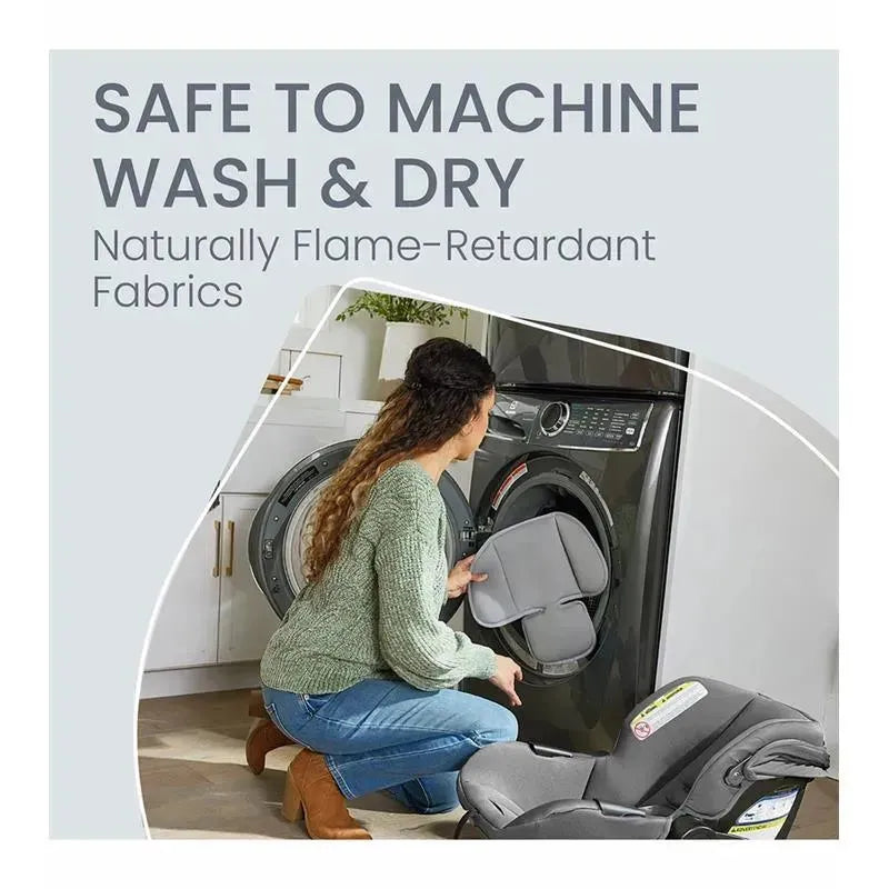 A woman kneels next to a washing machine, placing a car seat cover inside, promoting machine washability and flame-retardant fabrics.