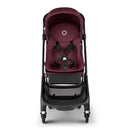 Compact Bugaboo Butterfly stroller in dark cherry color with a safety harness and storage basket.