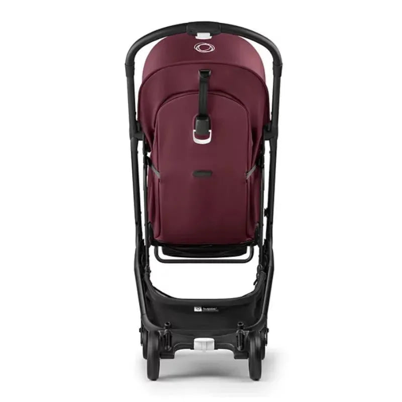 Compact Bugaboo Butterfly stroller in dark cherry, featuring a sleek foldable design and safety harness.