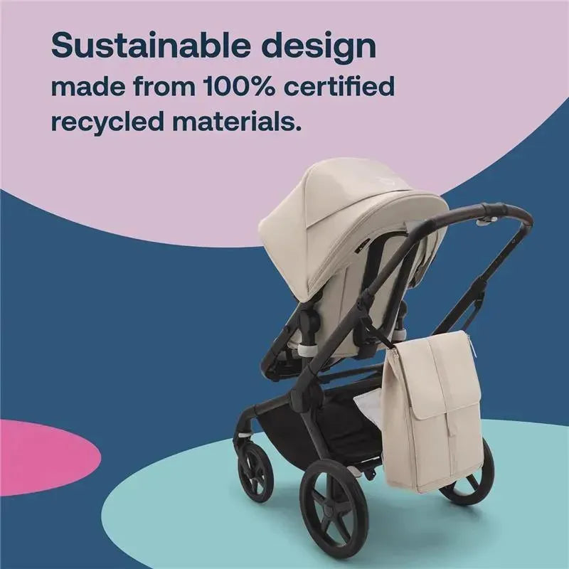 Changing backpack attached to a Bugaboo stroller, featuring a water-repellent desert taupe design and sustainable materials.