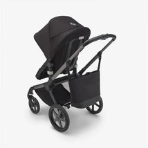 Changing bag in Midnight Black, featuring a sleek design, functional straps, and spacious compartments for baby essentials.