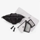 Midnight Black Bugaboo Changing Bag with adjustable straps, two mesh pouches, and a light-colored changing mat.