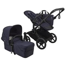 Bugaboo Donkey 6 Complete Stroller in Black/Deep Indigo featuring a stroller seat and a bassinet attached.