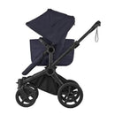 Complete Bugaboo Donkey 6 stroller in black and deep indigo, featuring a reclining seat, adjustable handle, and large wheels.