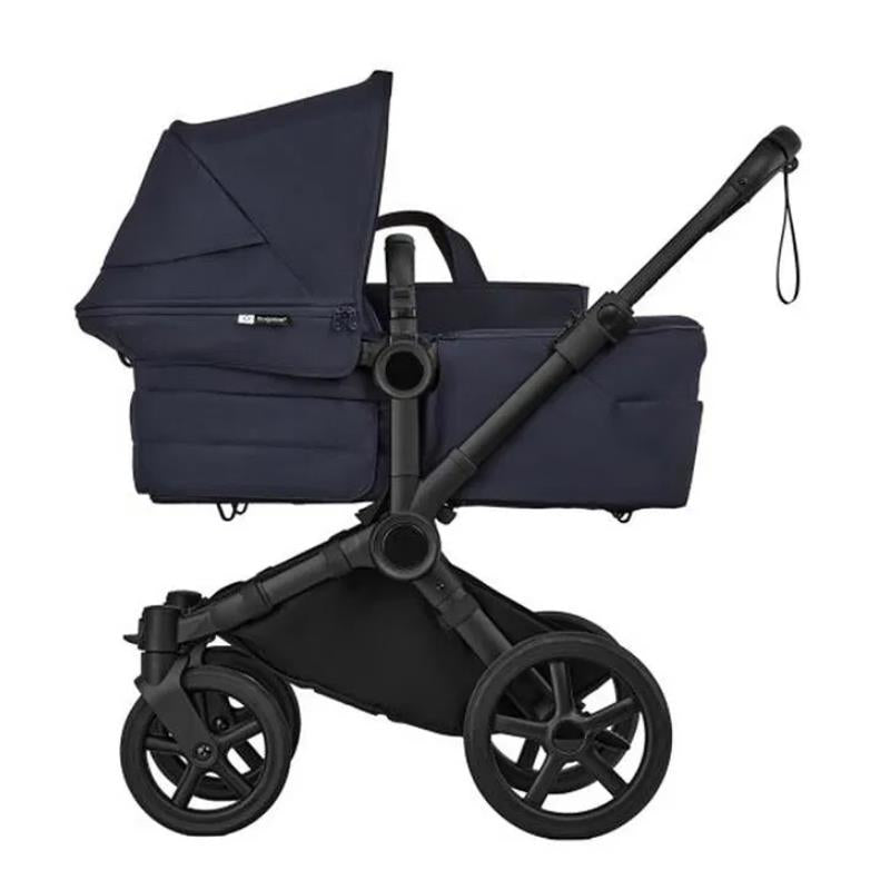 Bugaboo Donkey 6 Complete Stroller in black and deep indigo, featuring a modular design with a spacious seat and adjustable canopy.