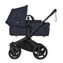 Bugaboo Donkey 6 Complete Stroller in black and deep indigo, featuring a modular design with a spacious seat and adjustable canopy.