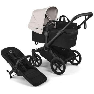 Bugaboo Donkey 6 Complete Stroller in black with a light beige canopy and removable seat, showcasing its sleek design and functionality.