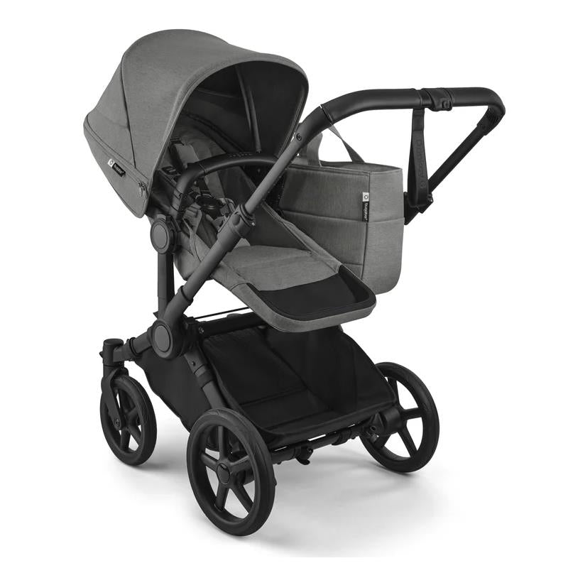 Bugaboo Donkey 6 Complete Stroller in Black/Moon Grey, featuring a spacious seat, large sun canopy, and a streamlined design.