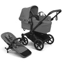 Bugaboo Donkey 6 Complete Stroller in Black/Moon Grey, featuring a detachable seat and carrycot, both with adjustable canopies.