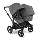 Bugaboo Donkey 6 Complete Stroller in black and moon grey, featuring a spacious seat and bassinet configuration for infants.