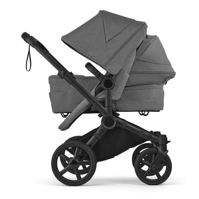 Bugaboo Donkey 6 Complete Stroller in Black/Moon Grey with two seats side by side and adjustable canopies.