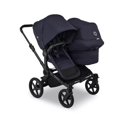 Bugaboo Donkey 6 Sibling Seat in Deep Indigo, featuring dual hoods and a spacious seating area for two children.
