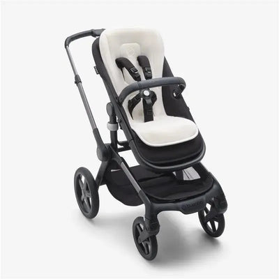 Bugaboo Dual Comfort Seat Liner in Fresh White featured in a black stroller, showcasing cushioned seating and harness.