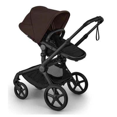 Bugaboo Fox 5 Renew Complete Bassinet & Seat in Black/Cocoa Brown, featuring a large canopy, ergonomic seat, and four wheels.