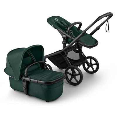 Bugaboo Fox 5 Renew Complete Bassinet and Seat in Black and Fern Green, featuring a sleek design with a comfortable seat and protective canopy.
