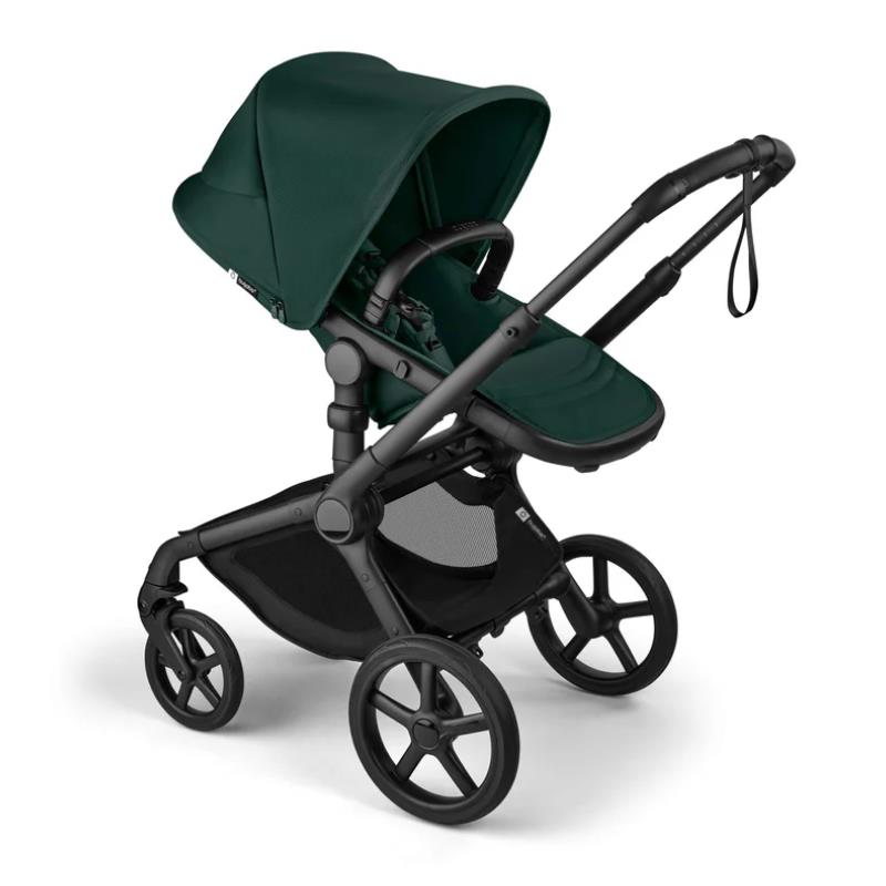 Bugaboo Fox 5 Renew complete bassinet and seat in black with fern green fabric, showcasing a modern stroller design.