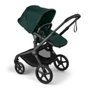 Bugaboo Fox 5 Renew complete bassinet and seat in black with fern green fabric, showcasing a modern stroller design.