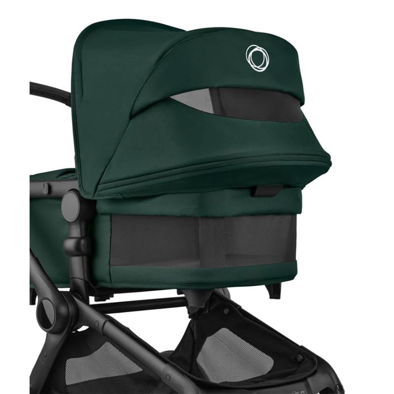 Bugaboo Fox 5 Renew Complete Bassinet and Seat in Black and Fern Green, showcasing the snug canopy and mesh paneling.