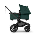 Bugaboo Fox 5 Renew Complete Bassinet and Seat in Black and Fern Green with a sleek design and spacious storage basket.