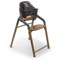 Bugaboo Giraffe High Chair Baby Set in grey, featuring a padded black seat and adjustable footrest.