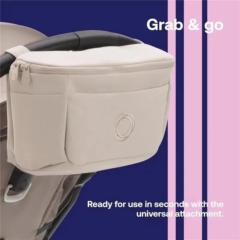 Organizing bag in Desert Taupe attached to a stroller handle, featuring a zipper closure and front pocket.