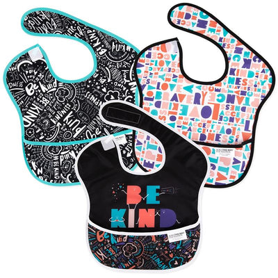 Three Bumkins SuperBib baby and toddler bibs featuring “Be Kind” designs in colorful patterns and styles.