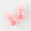 Silicone baby utensils set in pink jelly color, featuring a spoon and fork with ergonomic handles designed for infants.