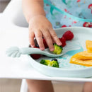 Silicone plate and spoon set featuring Princess Ariel, with a child reaching for broccoli and berries.