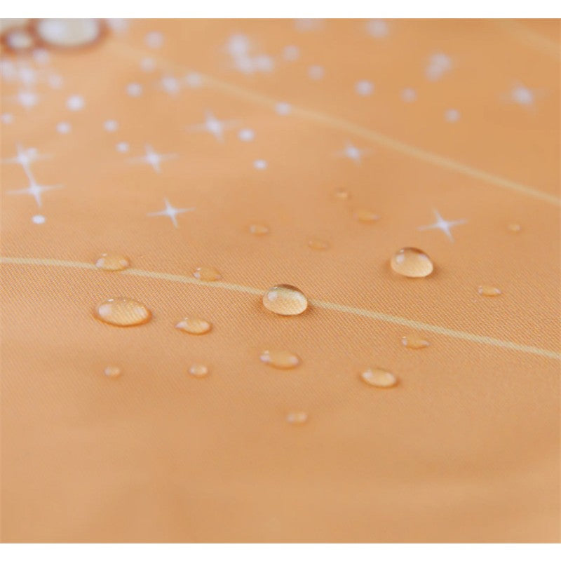 Ruffled orange apron bib with a Belle design, featuring water droplets and sparkles on the fabric.