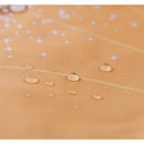 Ruffled orange apron bib with a Belle design, featuring water droplets and sparkles on the fabric.