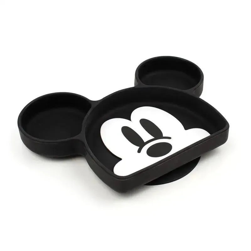 Silicone grip dish shaped like Mickey Mouse, featuring a black exterior and a white face design in the center.