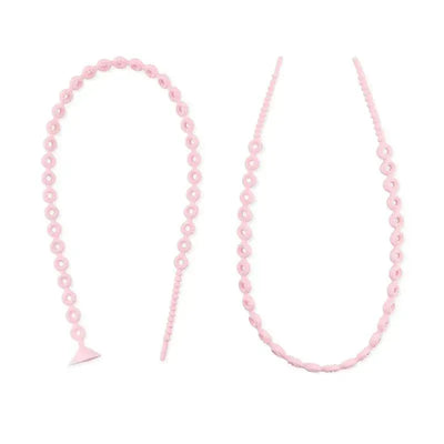 Pink silicone accessory tethers with looped designs, used to prevent loss of items like toys or sippy cups.