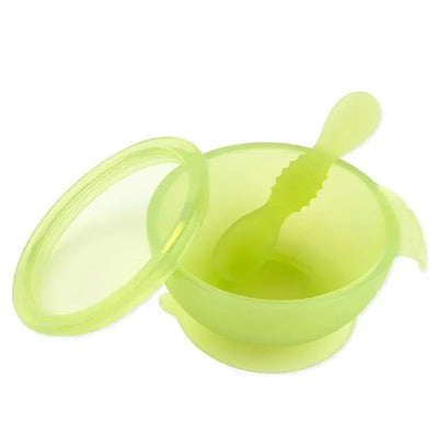 Silicone feeding set for babies and toddlers, featuring a suction bowl and matching spoon in translucent green.