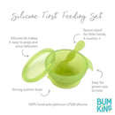 Silicone feeding set in green jelly with spoon, suction base, and lid for easy storage; safe for babies 4 months and up.