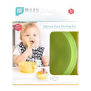 Silicone feeding set by Bumkins, featuring suction base, for babies and toddlers in green jelly, with a smiling baby using it.