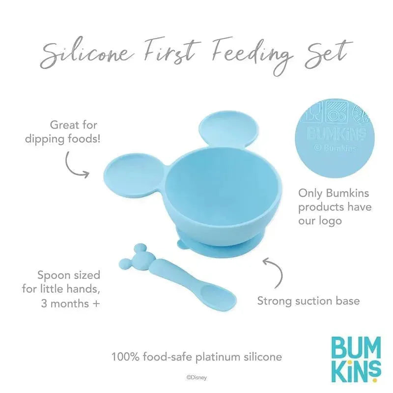 Silicone feeding set by Bumkins in light blue, featuring a suction bowl with Mickey Mouse ears and a small spoon.