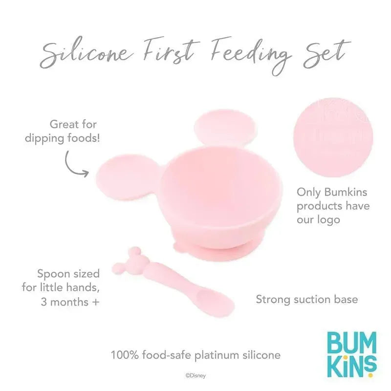 Silicone feeding set featuring a pink bowl with a suction base and a small spoon, designed for babies and toddlers.