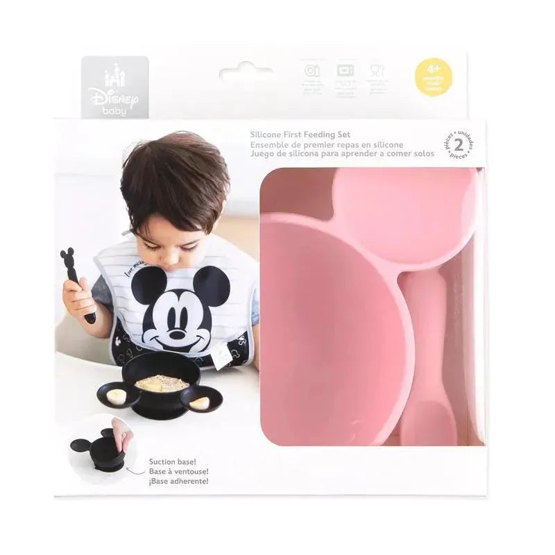 Silicone feeding set for babies and toddlers featuring a Minnie Mouse design, includes a pink plate and utensils.