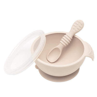 Bumkins silicone feeding bowl with lid and spoon in sand color, designed for first feeding.
