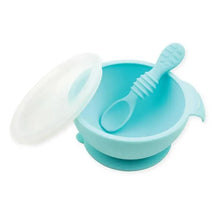 Silicone feeding set in blue with a bowl, lid, and matching spoon designed for first feeding.