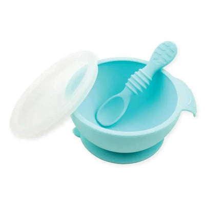 Silicone feeding set in blue with a bowl, lid, and matching spoon designed for first feeding.