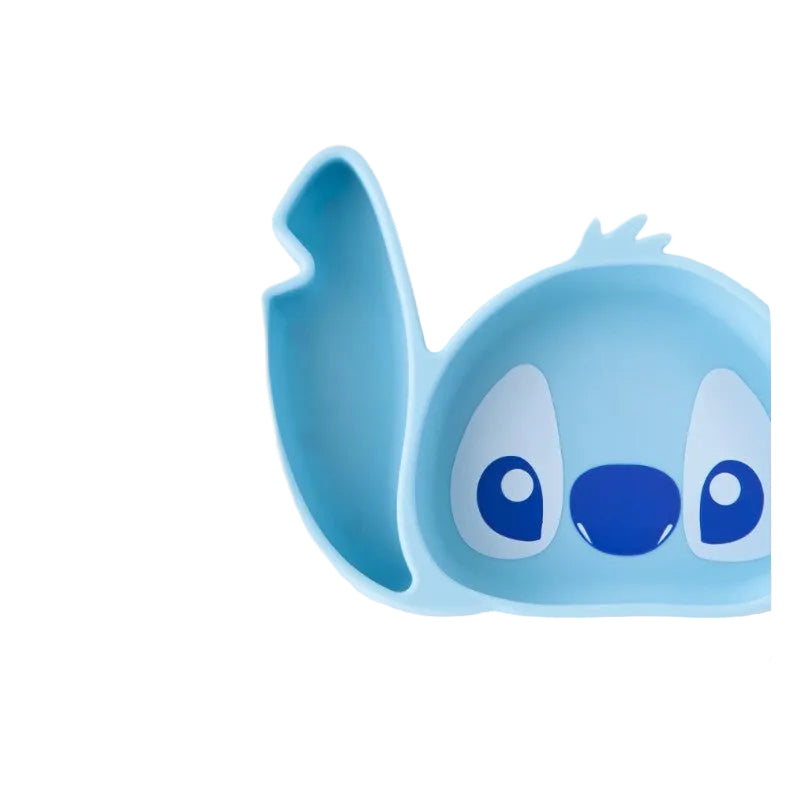 Bumkins Silicone Grip Dish in the shape of Stitch, featuring a blue design with large eyes and an ear.