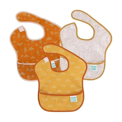 Three Bumkins SuperBib baby bibs in desert boho designs feature orange hues with sun and geometric patterns.