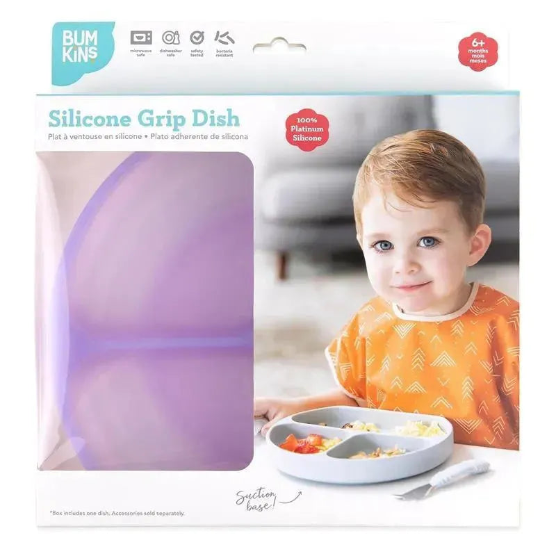 Bumkins Silicone Grip Dish in purple, featuring a child in an orange shirt, with a dish divided for food, highlighting a suction base.