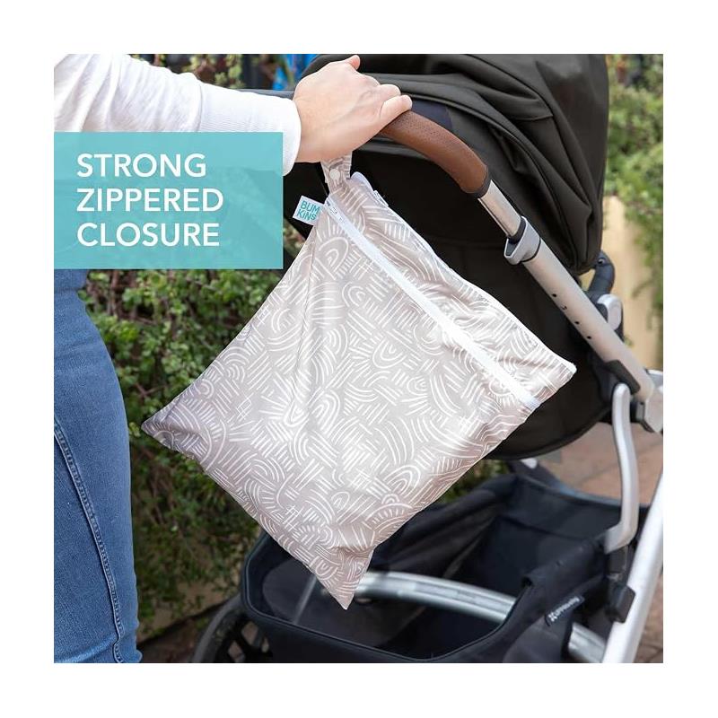 Bumkins Waterproof Wet Dry Bag for Baby in a neutral patterned design, featuring a strong zippered closure, hanging from a stroller.