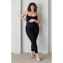 Black Bumpsuit The Kate Bumpsuit worn by a model with curly hair, standing against a neutral background.
