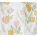 Floral pattern featuring pink and yellow tulips with green leaves on a white background, for a children’s romper set.