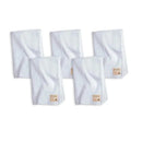 Five white organic burp cloths from Burt’s Bees, each featuring a small branded tag.